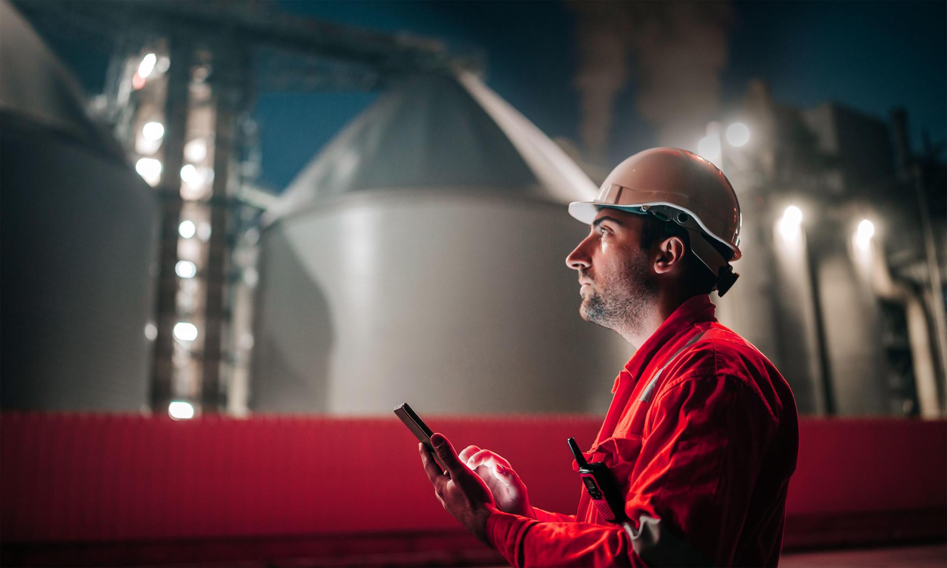 Man with helmet and ipad